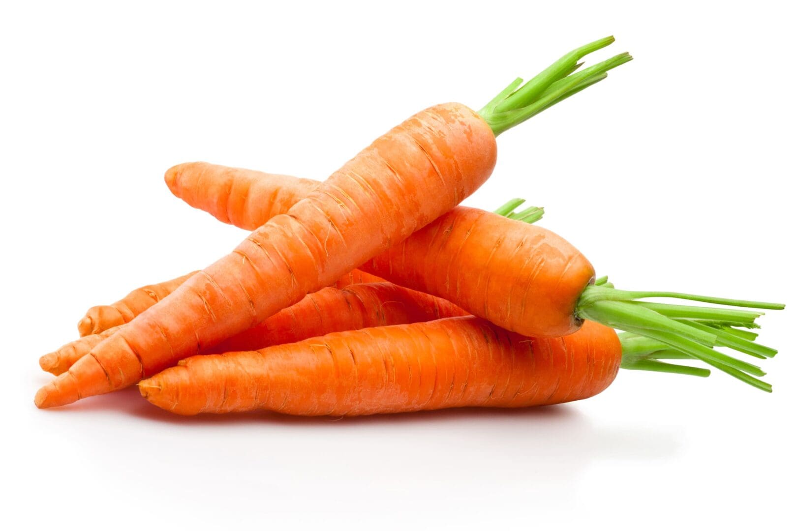 A bunch of carrots are sitting on the table