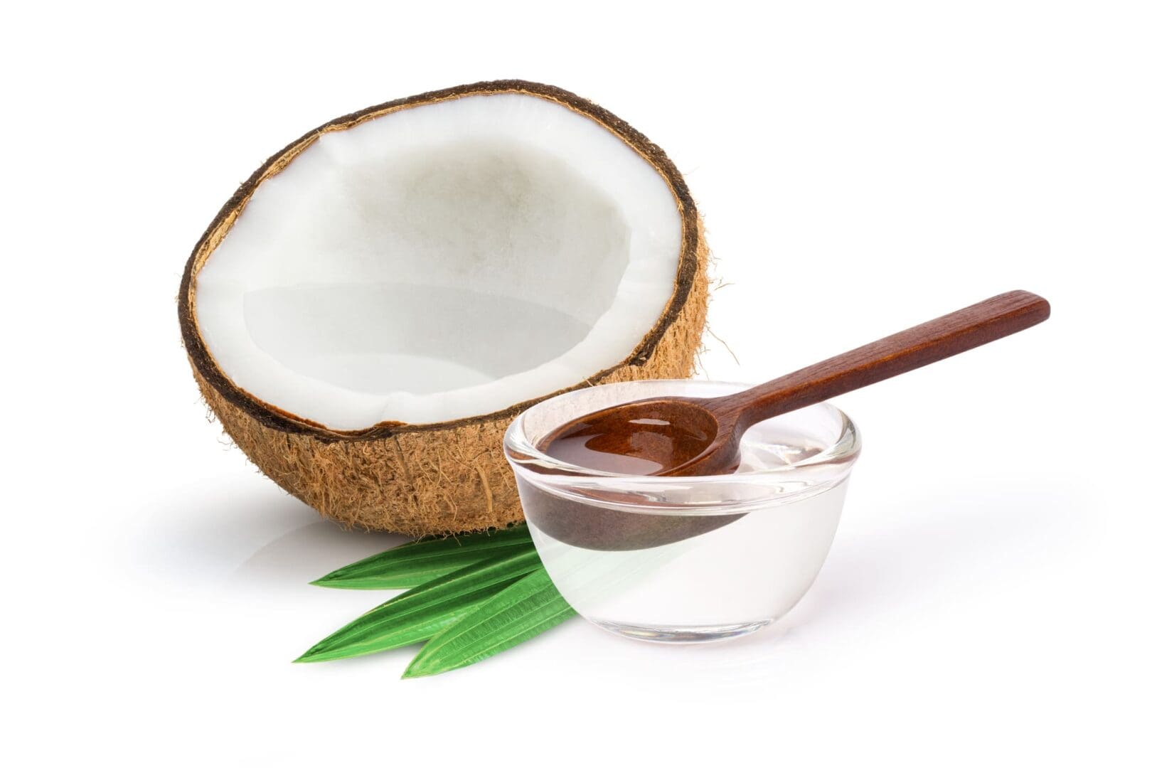 A close up of a spoon and bowl with coconut