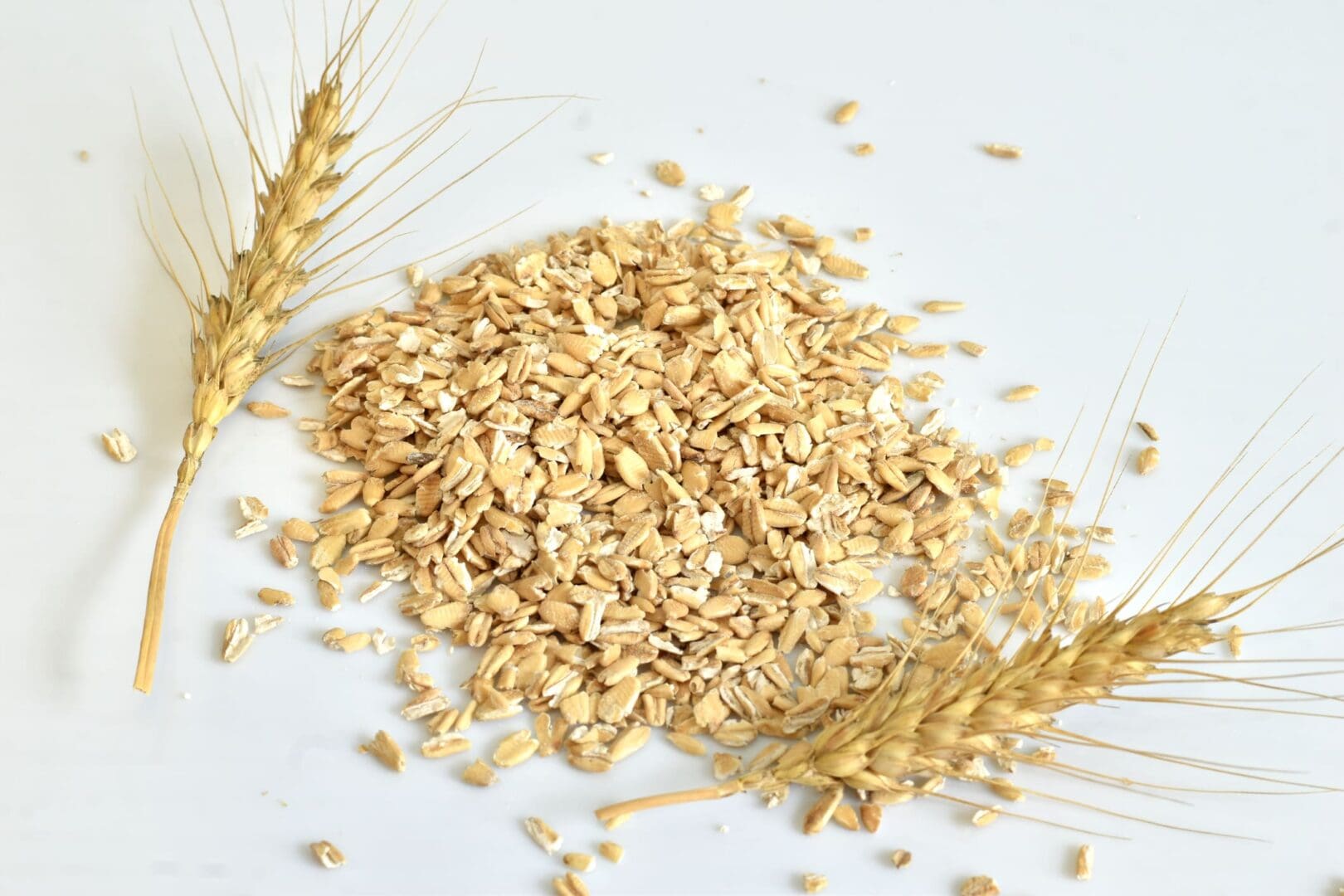 A pile of oats and two ears on top of the table.